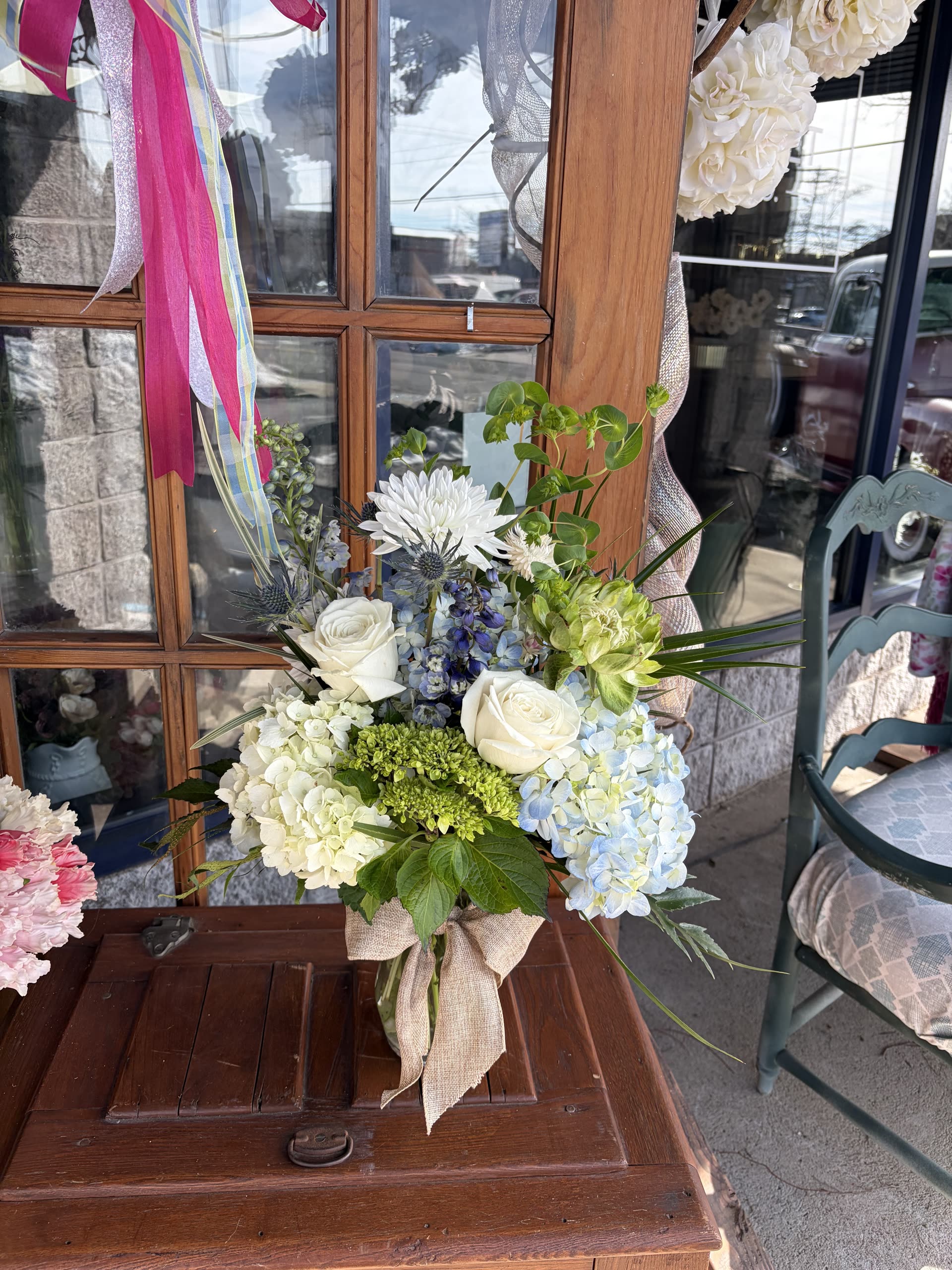 Nautical arrangement — hydrangea, roses, and mums