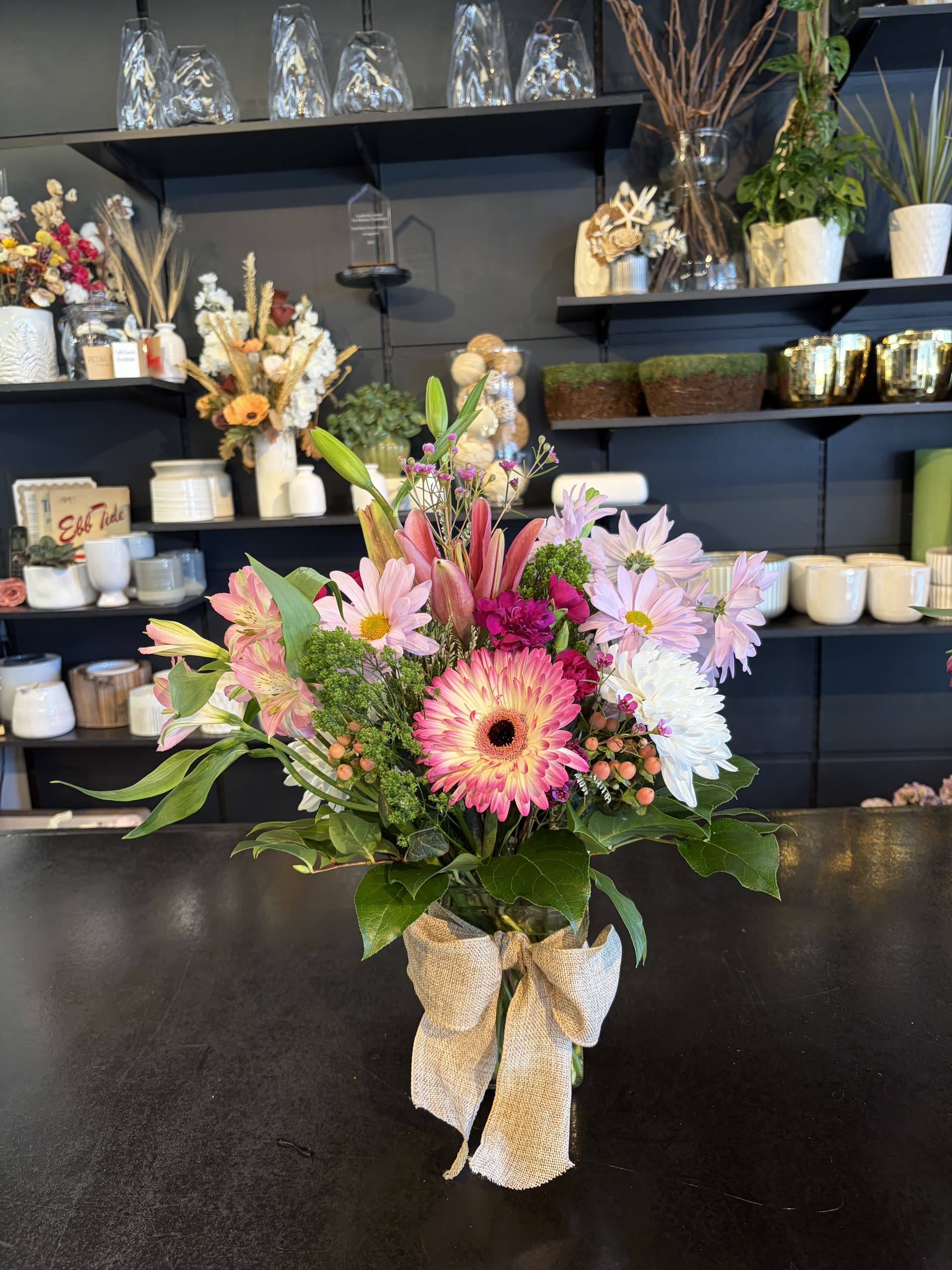 Spring vase — gerbera, lilies, and daisies