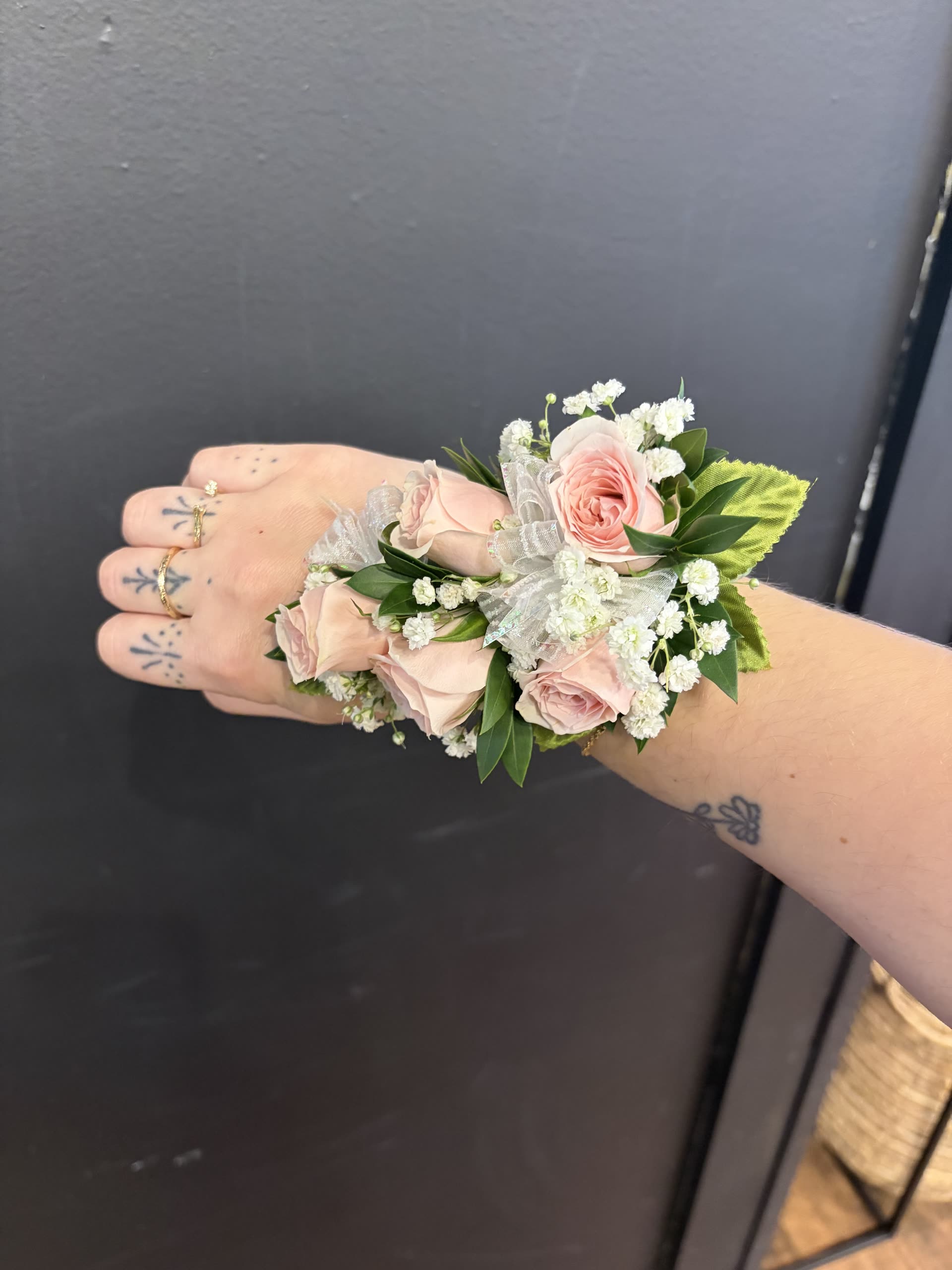 Wrist corsage — blush spray roses and baby's breath