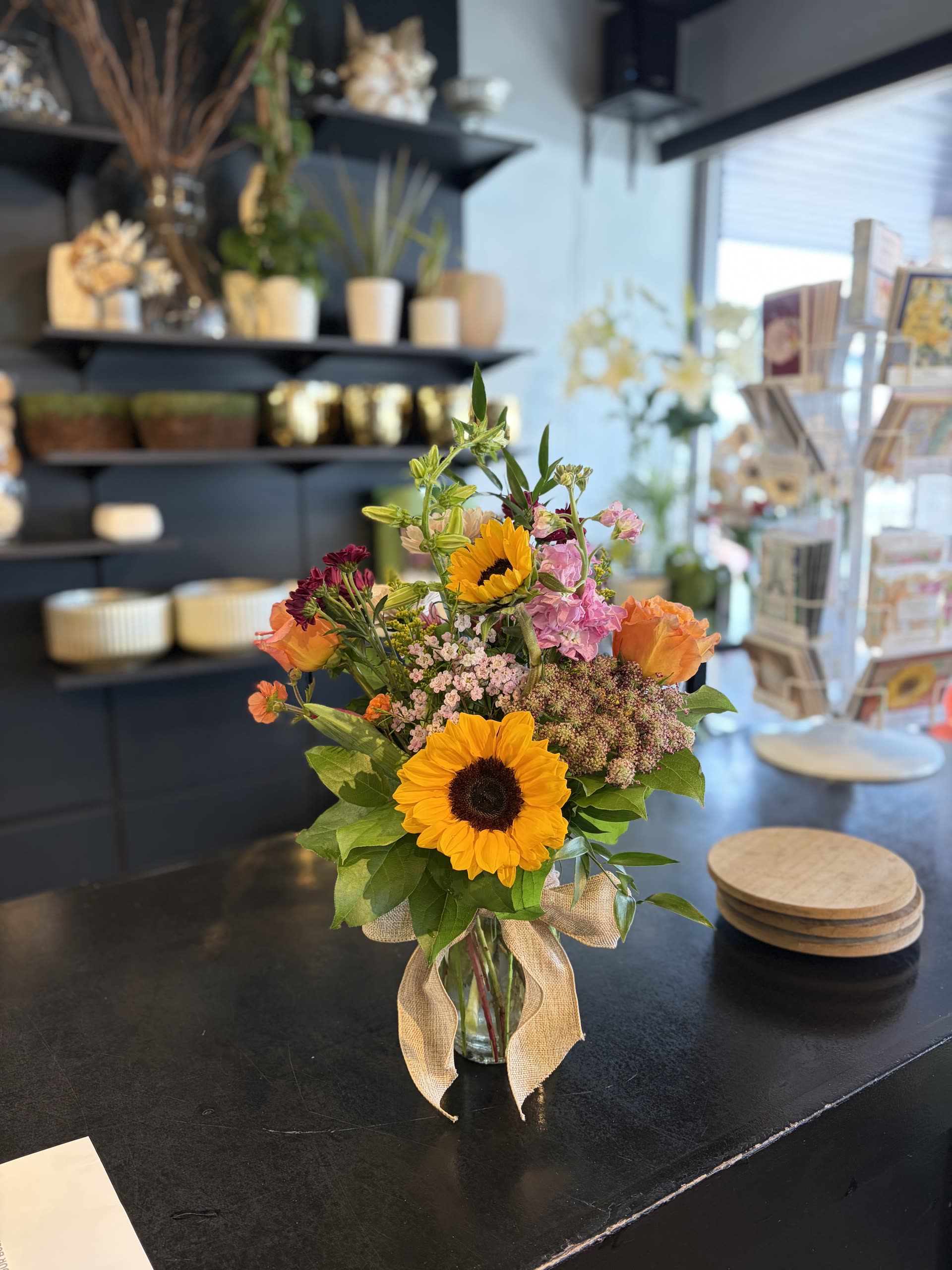 Small spring arrangement — sunflowers and mixed blooms